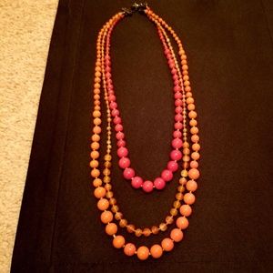 Red and orange beaded multi-strand necklace